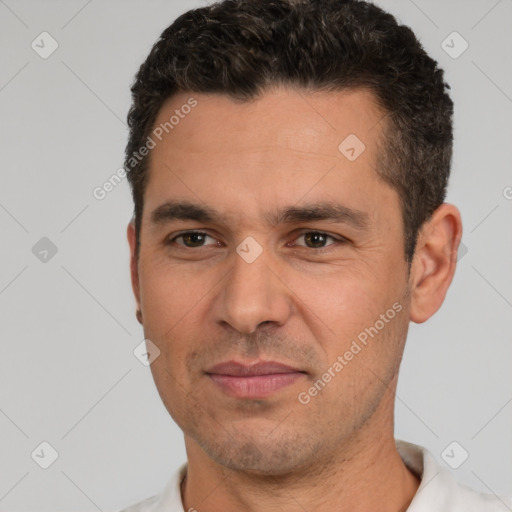 Joyful white young-adult male with short  black hair and brown eyes