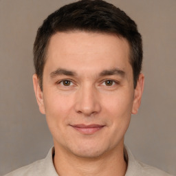 Joyful white adult male with short  brown hair and brown eyes