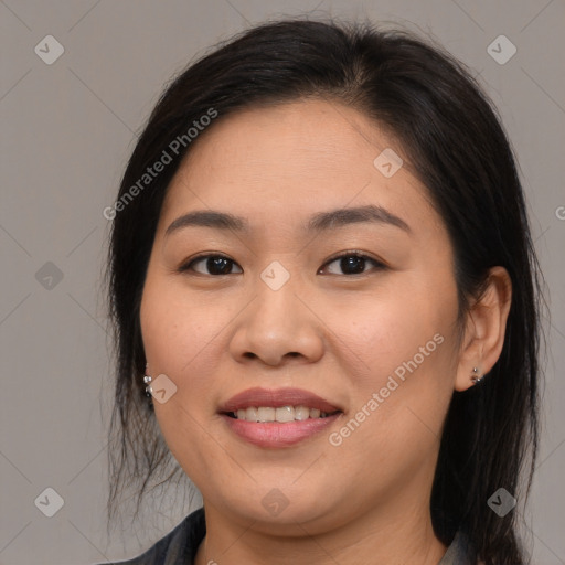 Joyful asian young-adult female with long  brown hair and brown eyes