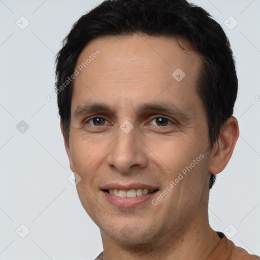 Joyful white young-adult male with short  black hair and brown eyes