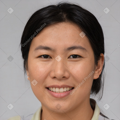 Joyful asian young-adult female with medium  brown hair and brown eyes