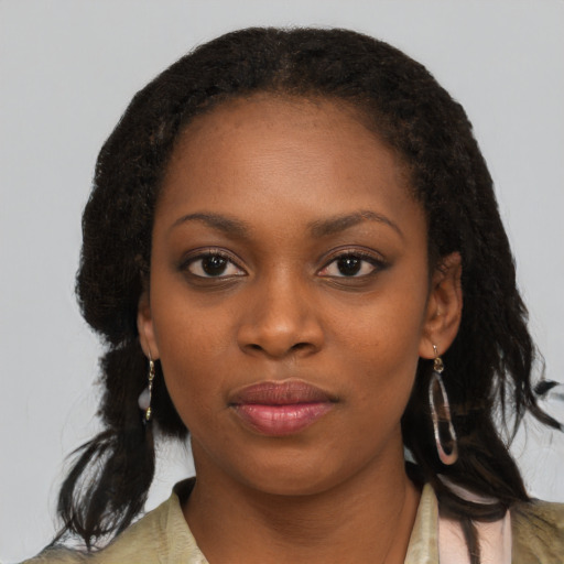 Neutral black young-adult female with medium  black hair and brown eyes