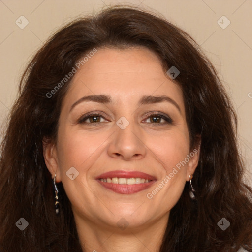 Joyful white adult female with long  brown hair and brown eyes