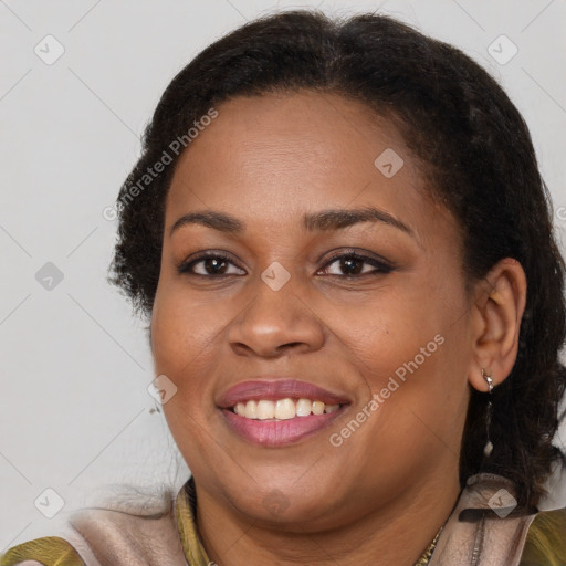 Joyful black young-adult female with long  brown hair and brown eyes