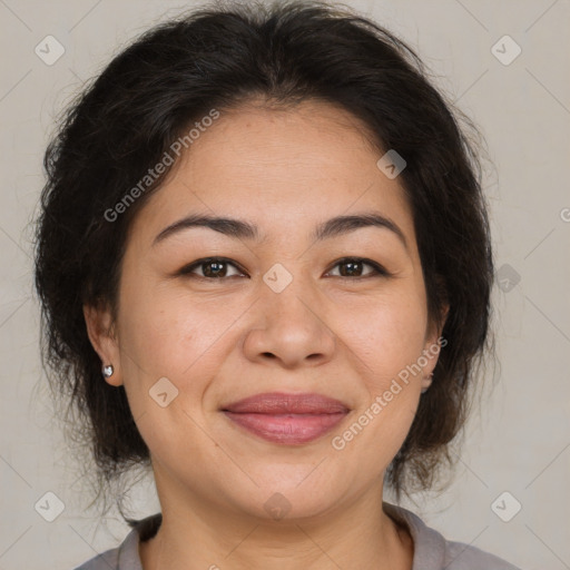 Joyful asian adult female with medium  brown hair and brown eyes