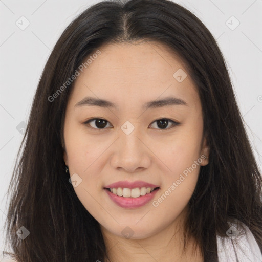 Joyful asian young-adult female with long  brown hair and brown eyes