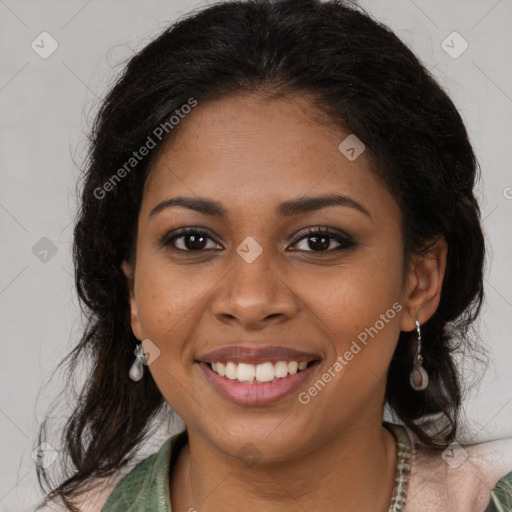 Joyful black young-adult female with long  brown hair and brown eyes