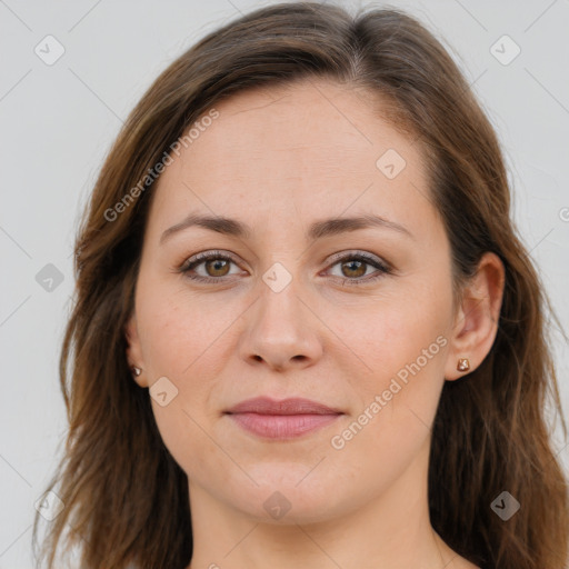 Joyful white young-adult female with long  brown hair and brown eyes