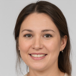 Joyful white young-adult female with medium  brown hair and brown eyes