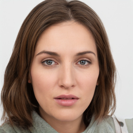 Neutral white young-adult female with medium  brown hair and green eyes