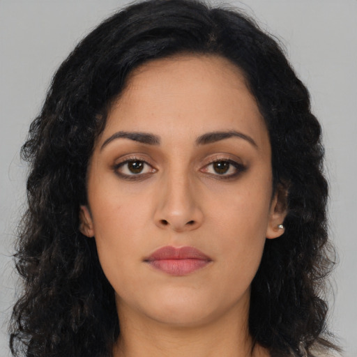 Neutral latino young-adult female with long  black hair and brown eyes