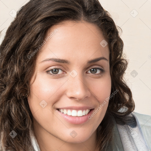 Joyful white young-adult female with long  brown hair and green eyes