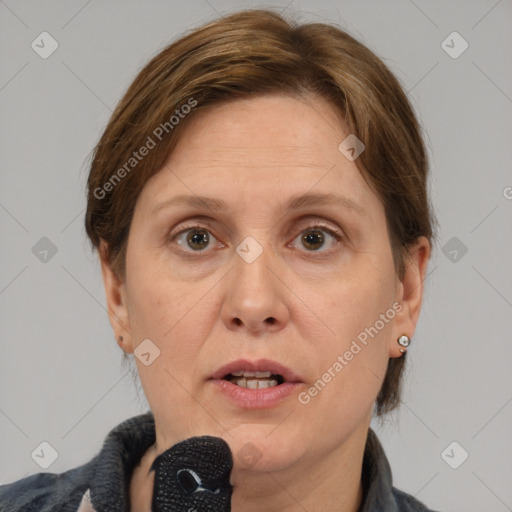 Joyful white adult female with medium  brown hair and grey eyes