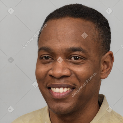 Joyful latino young-adult male with short  brown hair and brown eyes