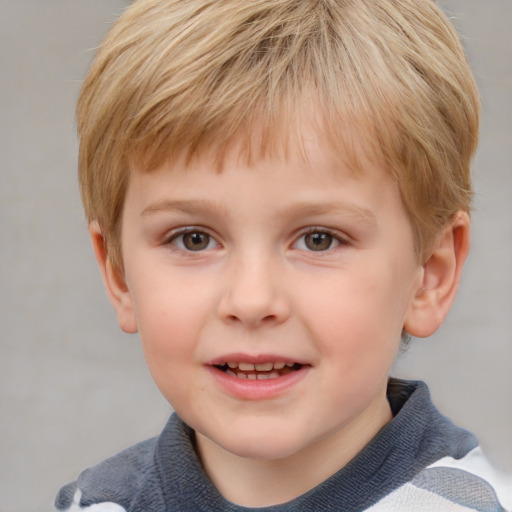 Joyful white child male with short  brown hair and grey eyes