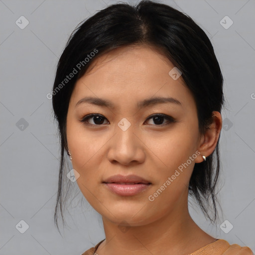 Joyful asian young-adult female with medium  black hair and brown eyes