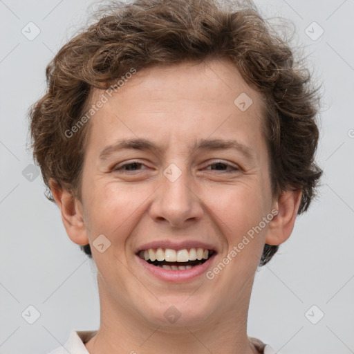 Joyful white adult female with short  brown hair and brown eyes