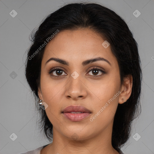 Joyful latino young-adult female with medium  brown hair and brown eyes