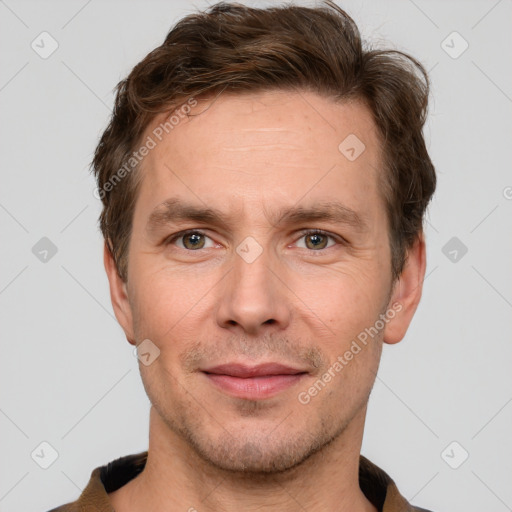 Joyful white adult male with short  brown hair and grey eyes