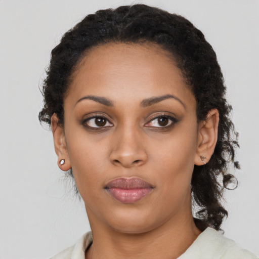 Neutral latino young-adult female with short  black hair and brown eyes