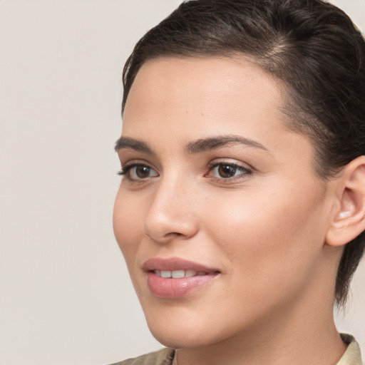 Joyful white young-adult female with medium  brown hair and brown eyes