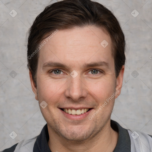 Joyful white adult male with short  brown hair and grey eyes