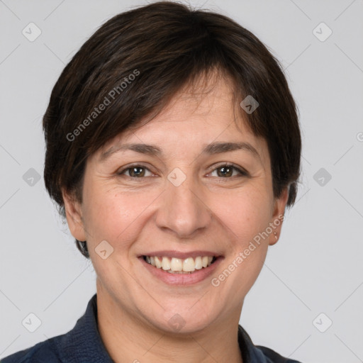 Joyful white adult female with short  brown hair and grey eyes