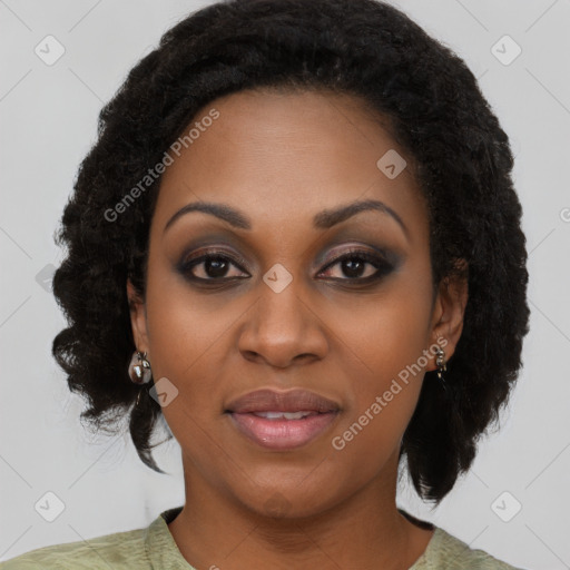 Joyful black young-adult female with medium  black hair and brown eyes