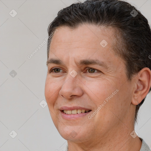 Joyful white adult male with short  brown hair and brown eyes