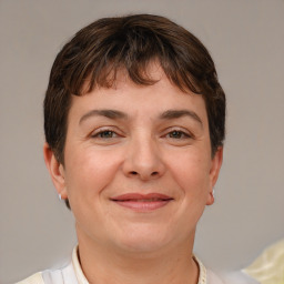 Joyful white adult female with short  brown hair and brown eyes