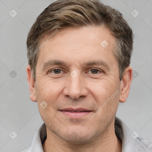 Joyful white adult male with short  brown hair and grey eyes