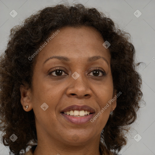 Joyful black adult female with medium  brown hair and brown eyes