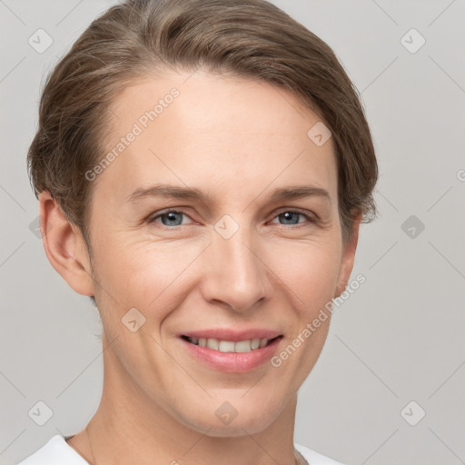 Joyful white young-adult female with short  brown hair and grey eyes