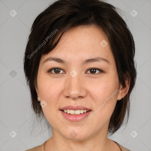 Joyful white adult female with medium  brown hair and brown eyes