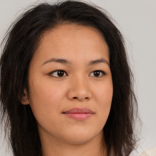 Joyful white young-adult female with long  brown hair and brown eyes