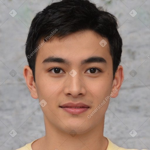 Joyful asian young-adult male with short  black hair and brown eyes