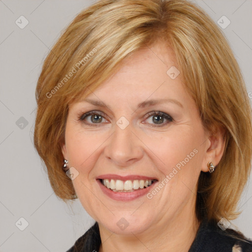 Joyful white adult female with medium  brown hair and brown eyes