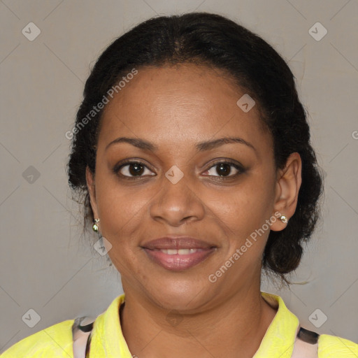 Joyful black adult female with short  brown hair and brown eyes