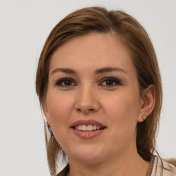 Joyful white young-adult female with medium  brown hair and grey eyes