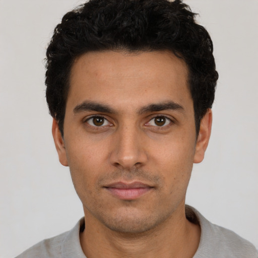 Neutral white young-adult male with short  black hair and brown eyes