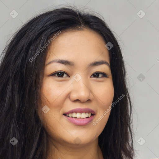 Joyful latino young-adult female with long  brown hair and brown eyes