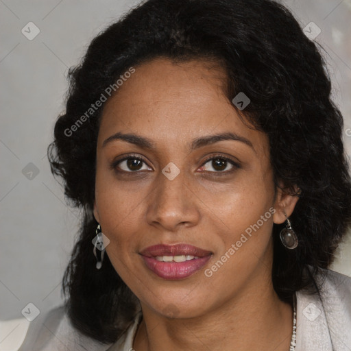 Joyful black young-adult female with long  black hair and brown eyes