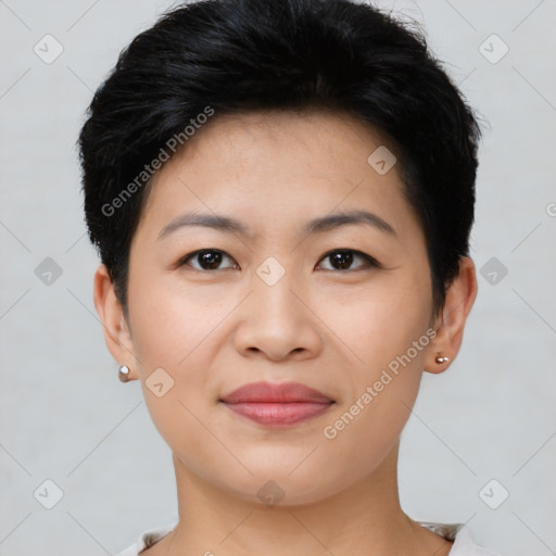 Joyful asian young-adult female with short  black hair and brown eyes