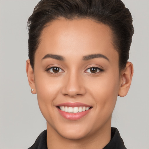 Joyful white young-adult female with short  brown hair and brown eyes