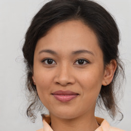 Joyful white young-adult female with medium  brown hair and brown eyes