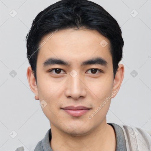 Joyful asian young-adult male with short  black hair and brown eyes