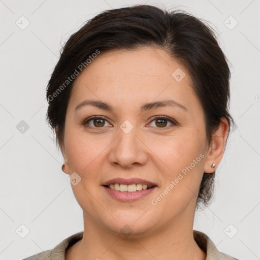 Joyful white adult female with short  brown hair and brown eyes