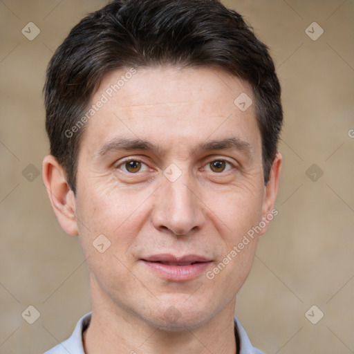 Joyful white adult male with short  brown hair and brown eyes