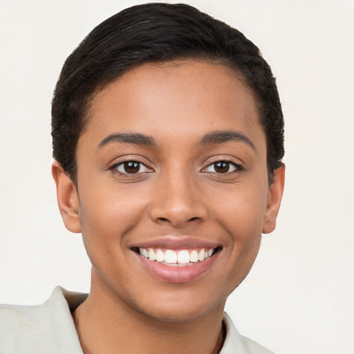 Joyful latino young-adult female with short  brown hair and brown eyes