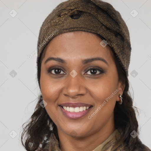 Joyful black young-adult female with long  brown hair and brown eyes